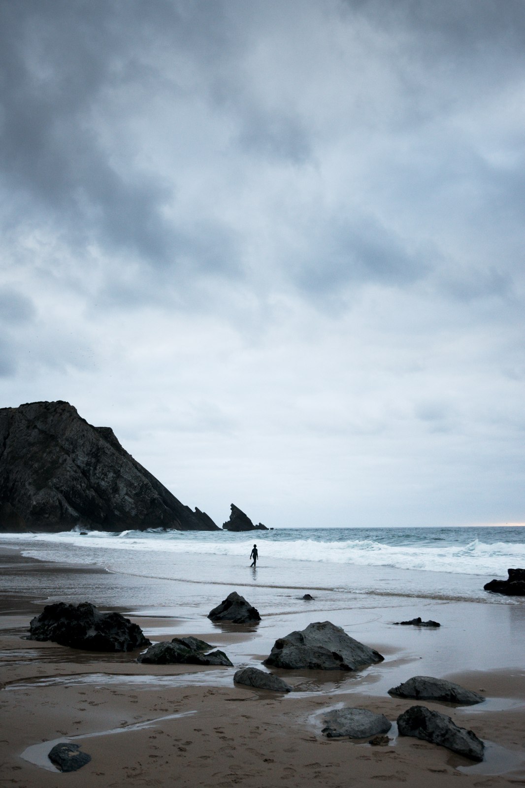 I love rocky coastlines and stormy days, and this surfer at Adraga Beach was the cherry on top.