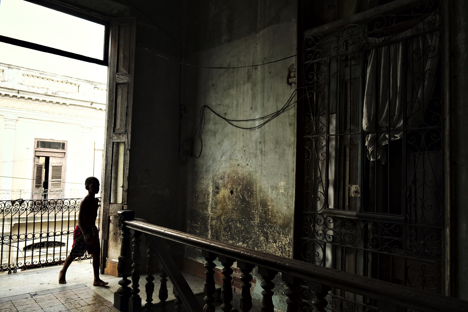 Solares, the derelict and partially abandoned houses occupied by families that make each division into their home. This one is an old hotel in the center of Cienfuegos.