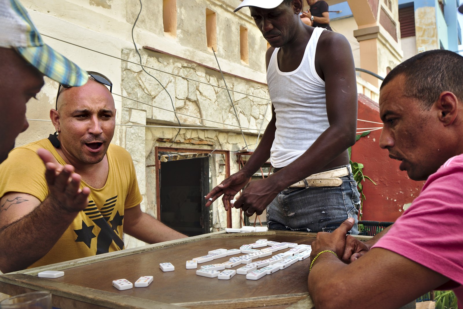 Playing domino in the street by the Malecón, rum was included in the mix.